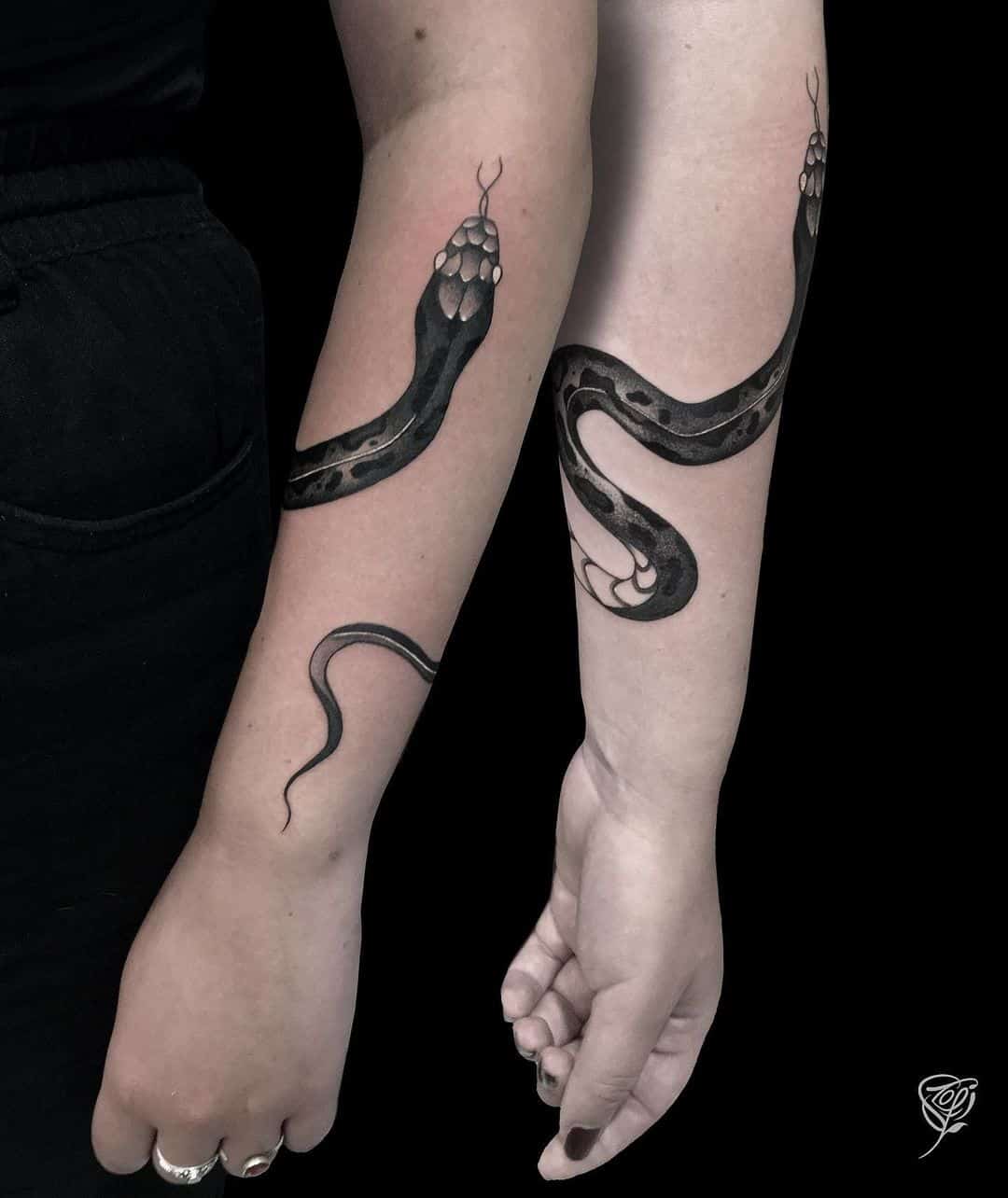 Couple matching snake tattoo