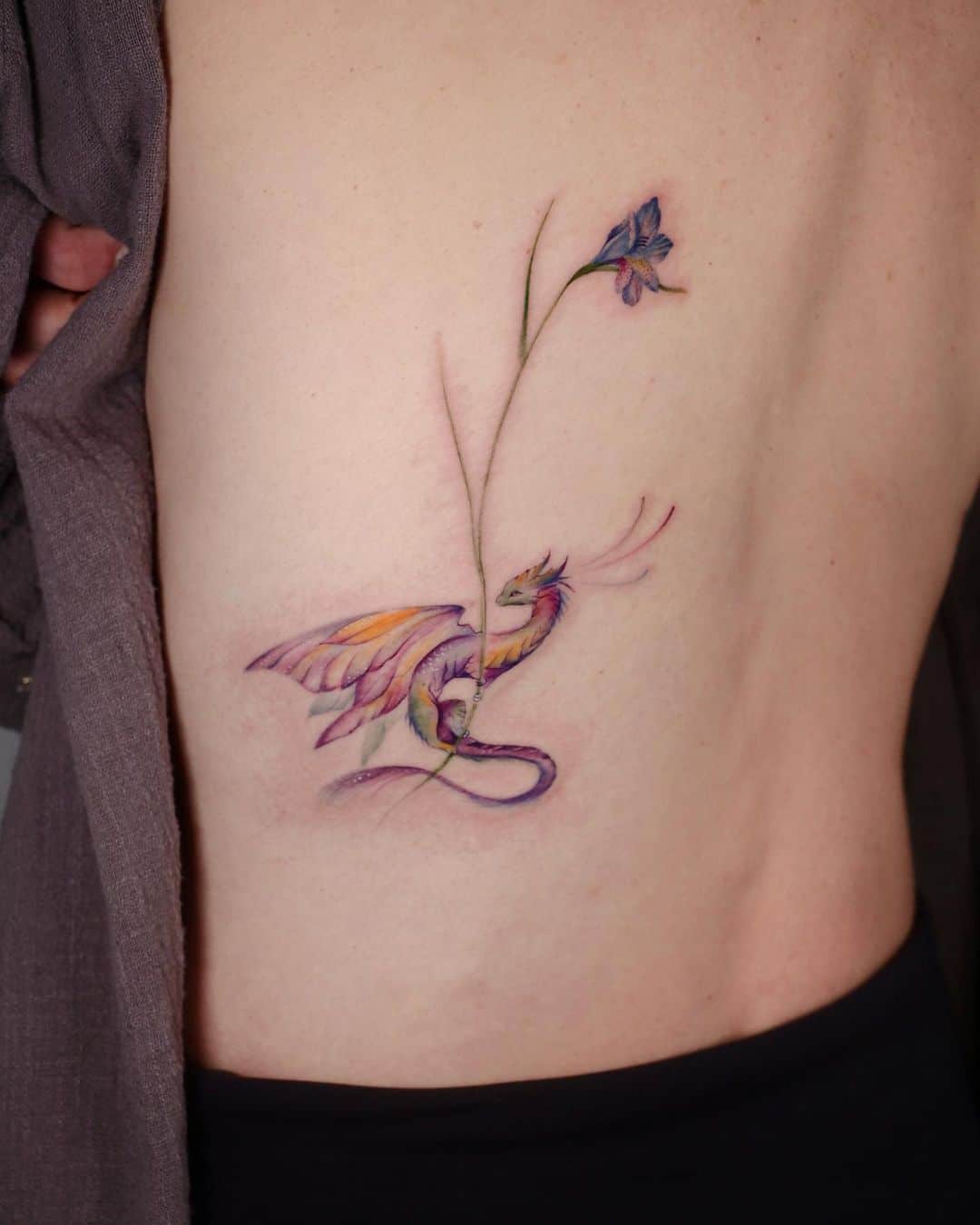 cute dragon tattoo on back