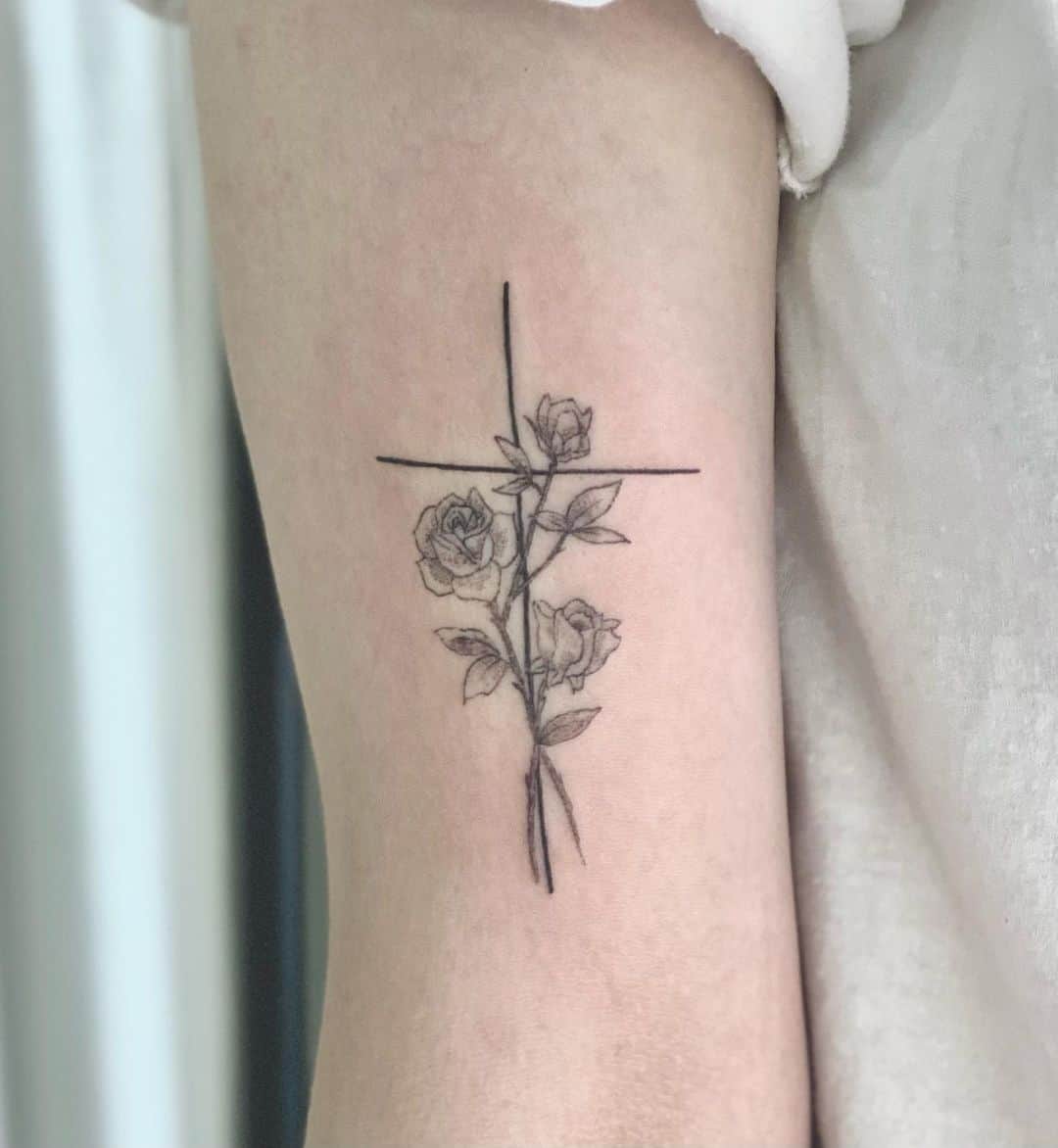 cross with flower tattoo
