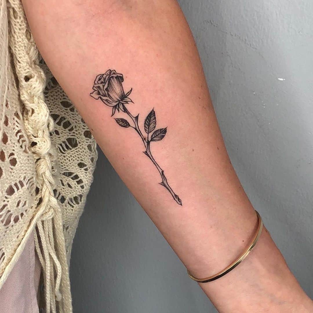 black inked rose tattoo