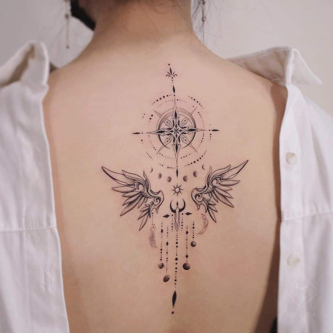 compass style dream tattoo on back