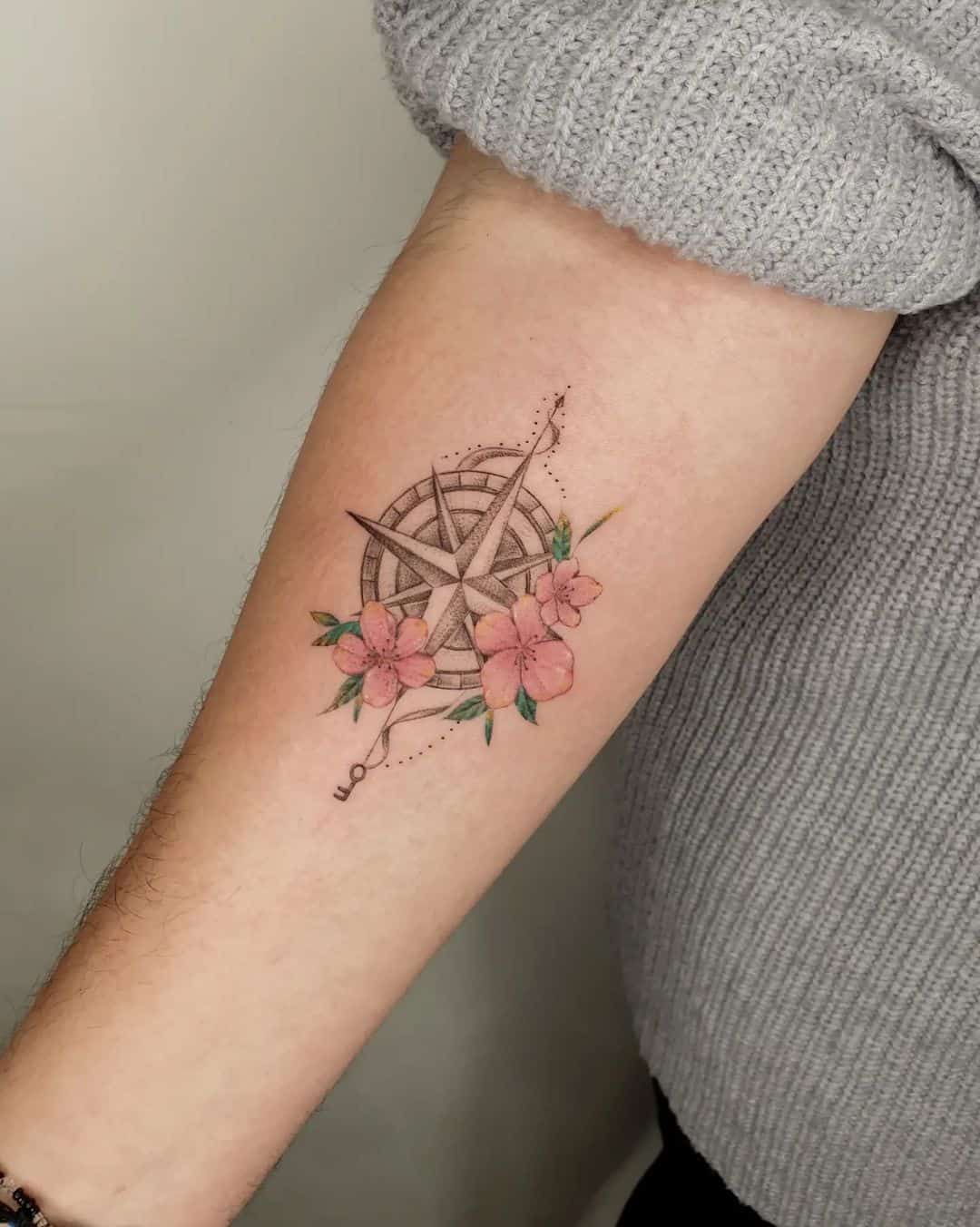flower and coompass tattoo