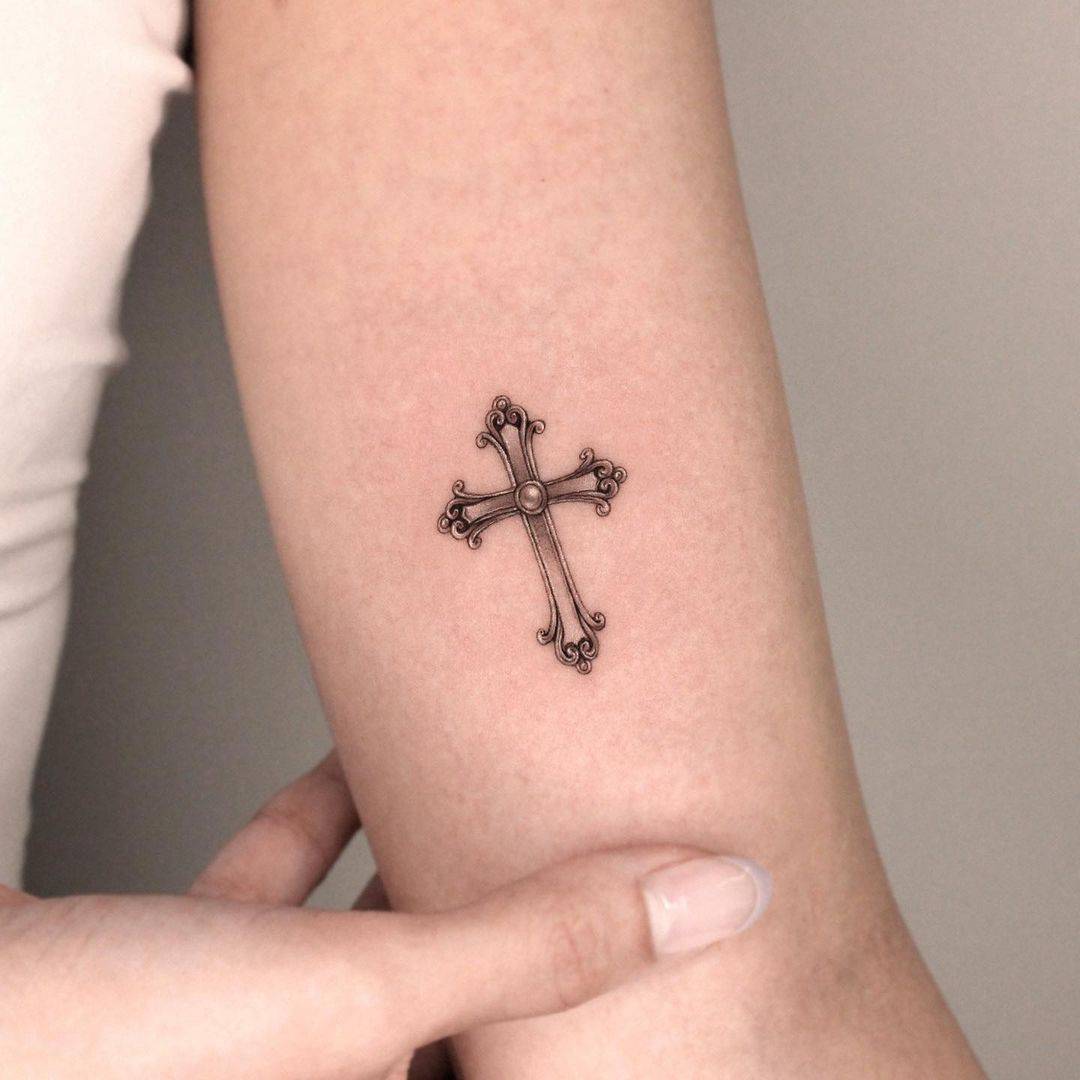 small cross sign tattoo