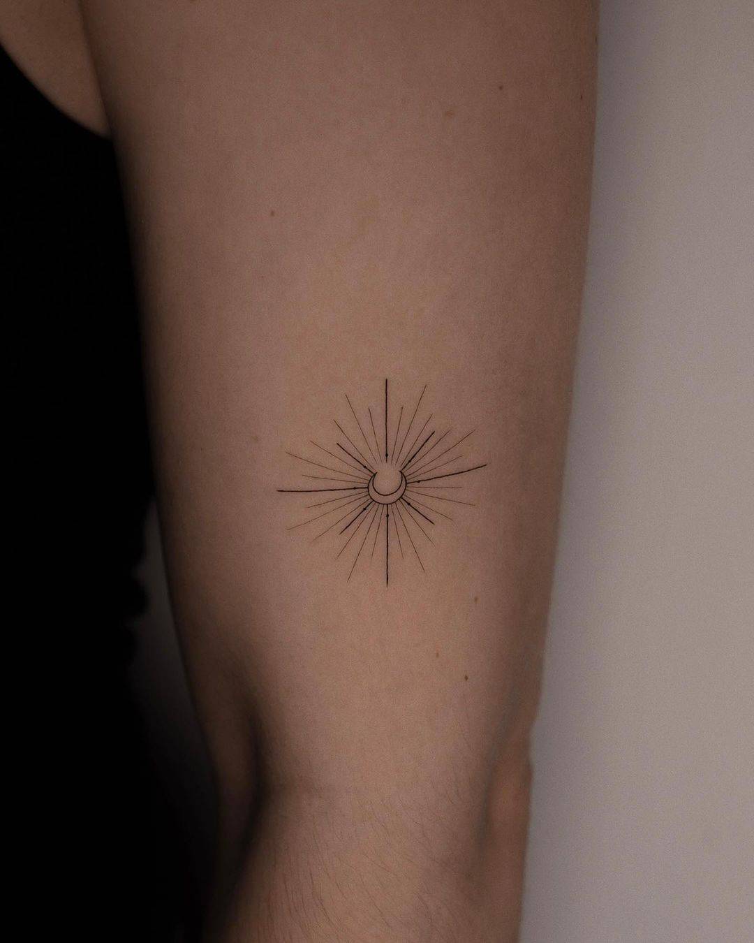 cute sun tattoo on arm