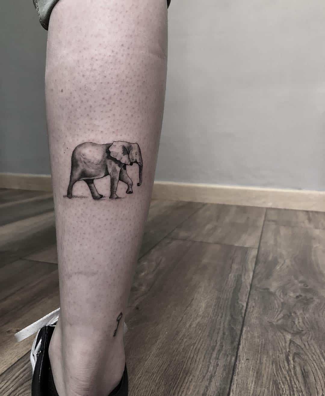 elephant tattoo on leg