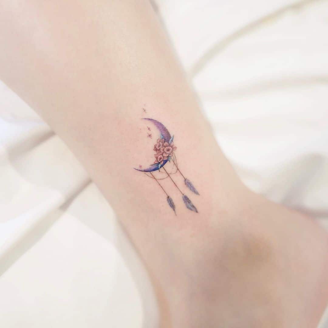 half moon inspired dream catcher tattoo