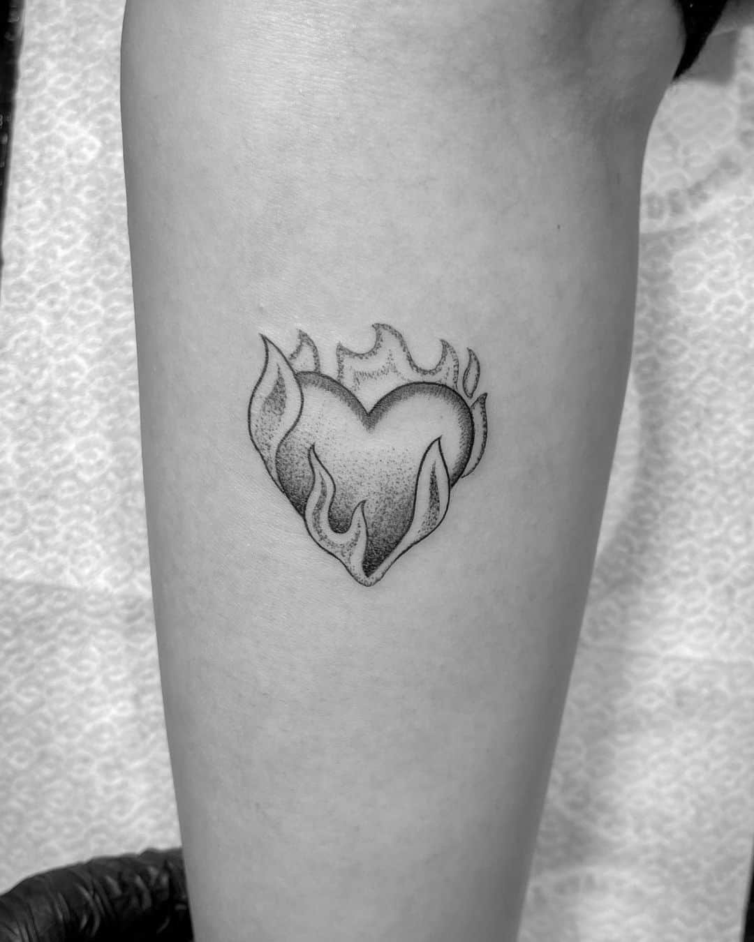 heart burning on fire tattoo 