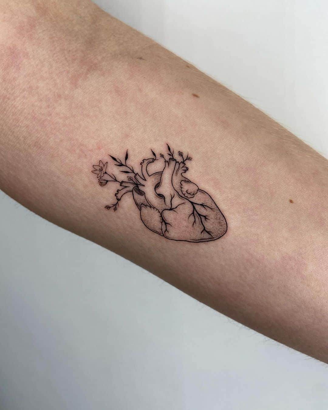 heart tattoo on arms