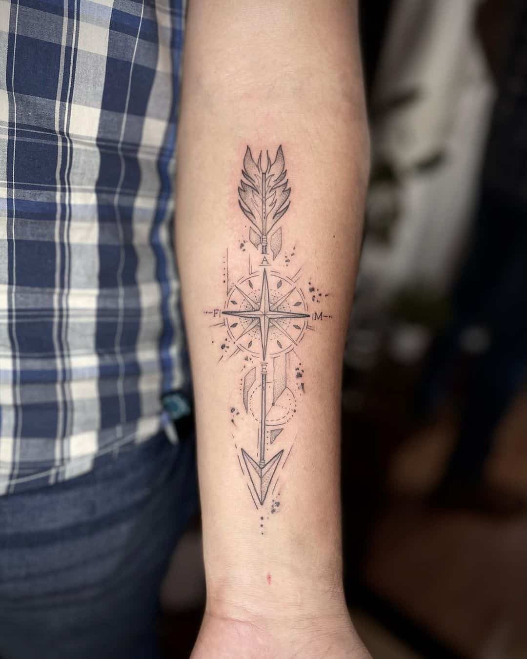 arrow style compass tattoo 