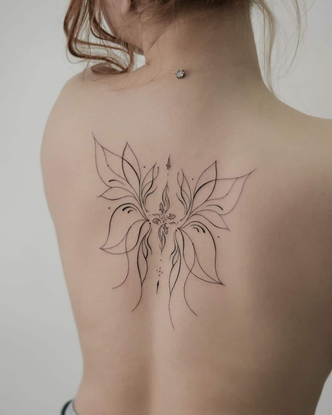 unique style wing tattoo on back