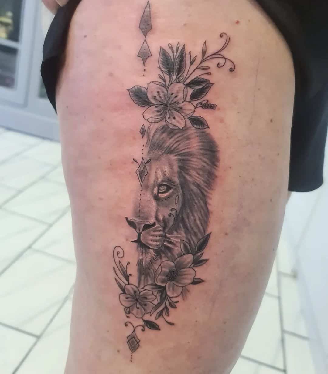 half face lion tattoo