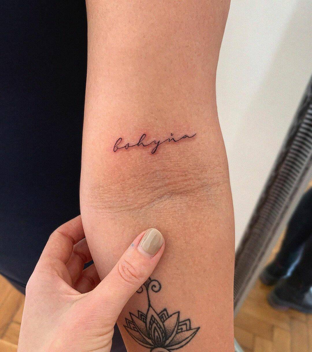 small and simple tattoo on arm