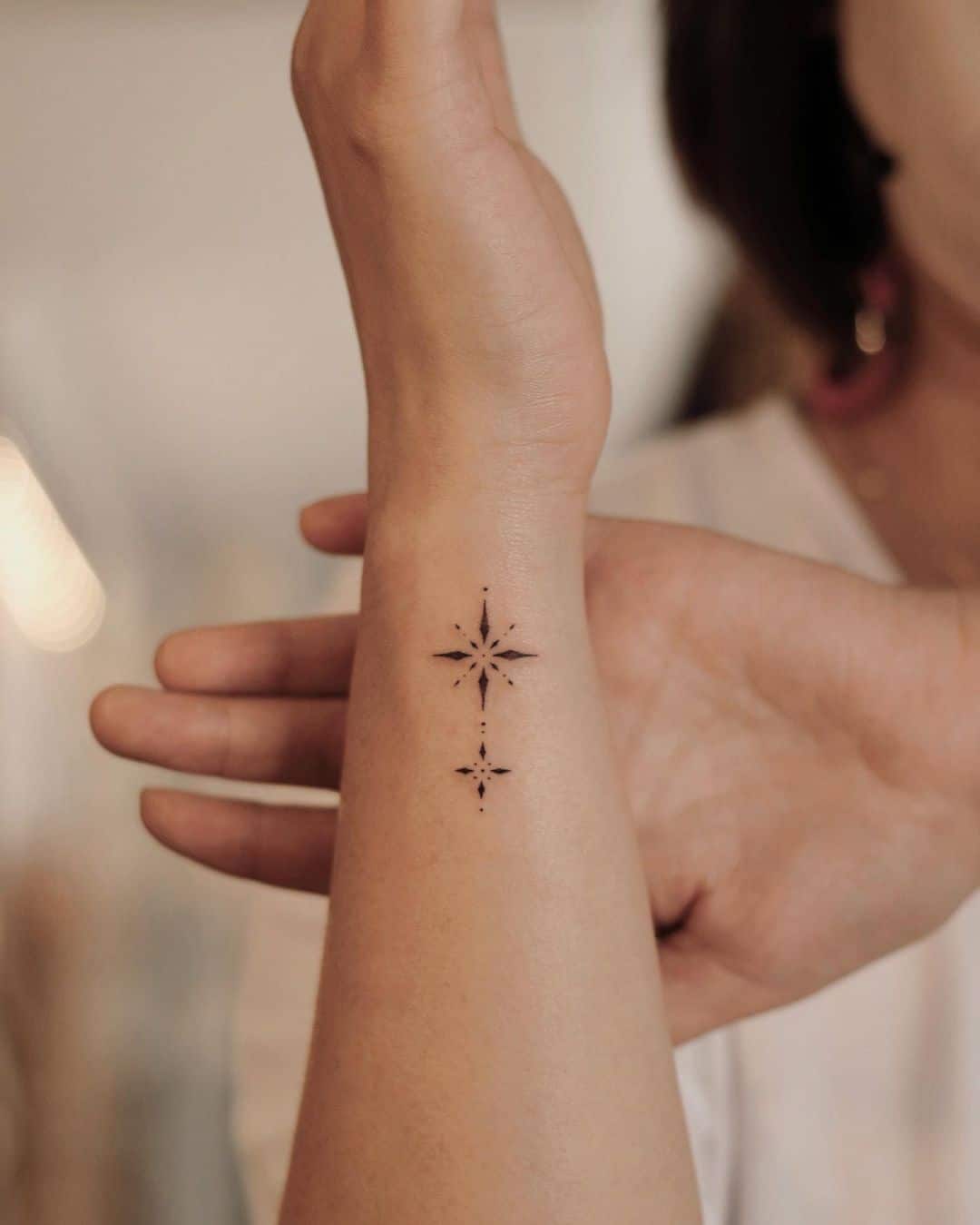 unique star tattoo on wrist