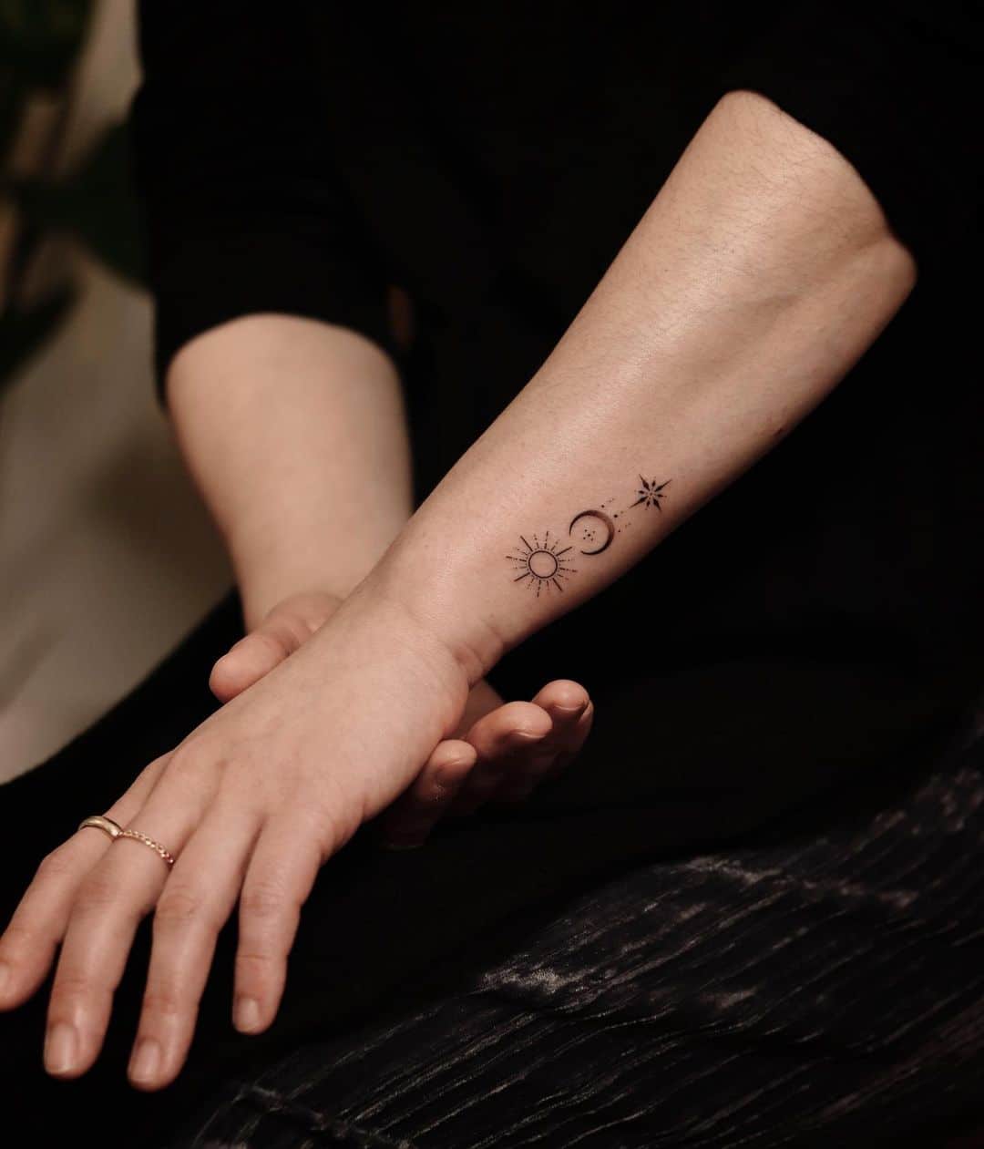 sun and moon tattoo on wrist