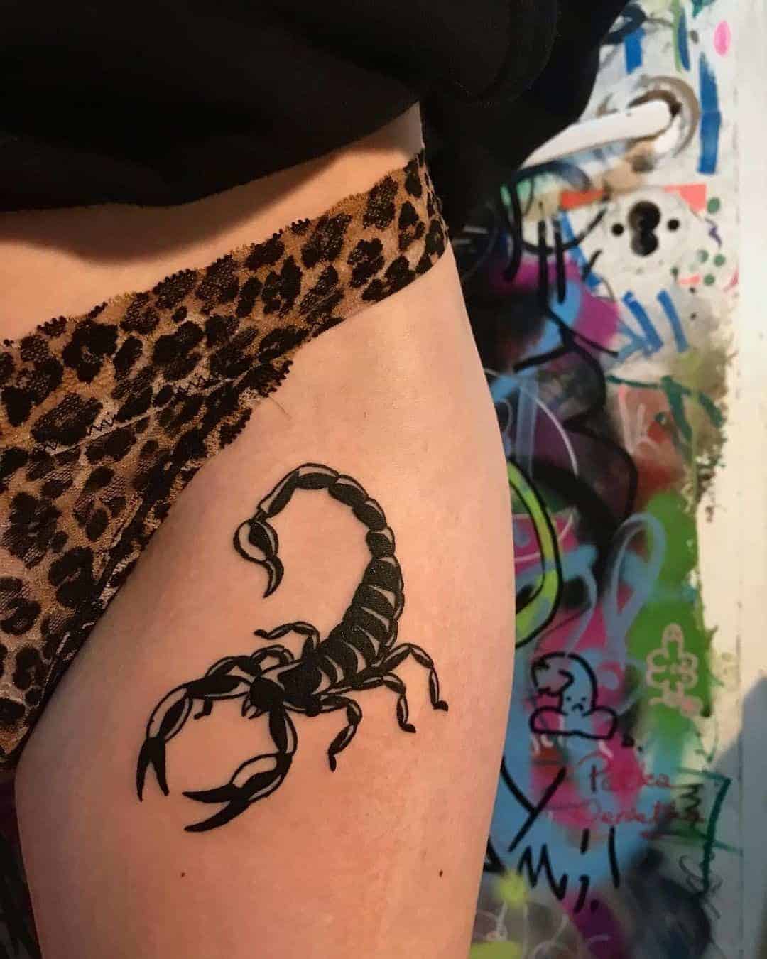 scorpion thigh tattoo
