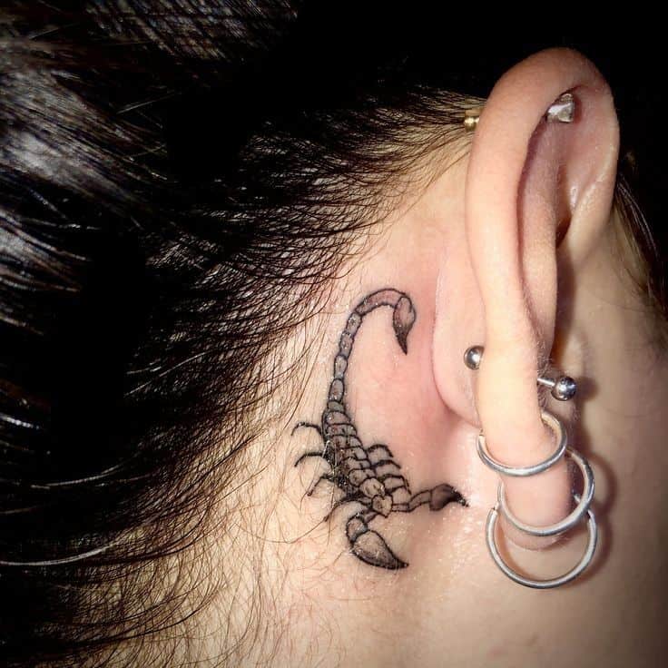 scorpion neckline tattoo