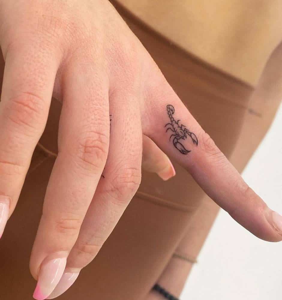 scorpion tattoo on finger