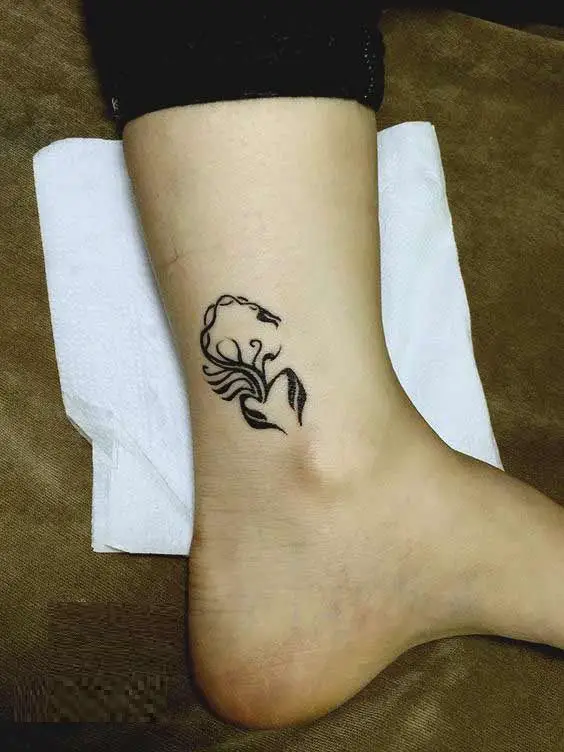 scorpion tattoo on leg