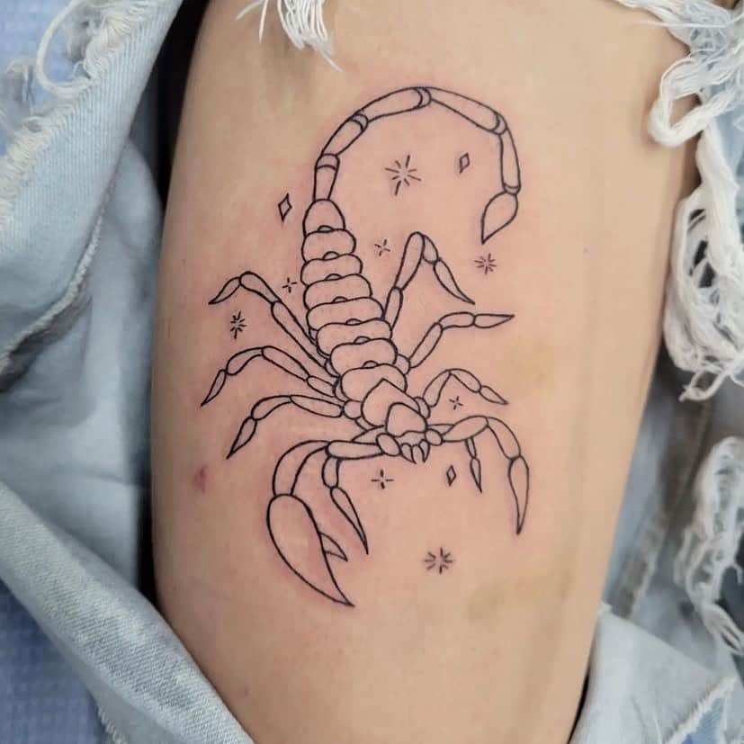 
scorpion tattoo on upper arm