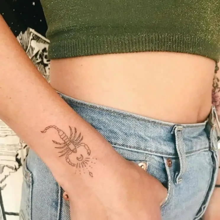 scorpion wrist tattoo