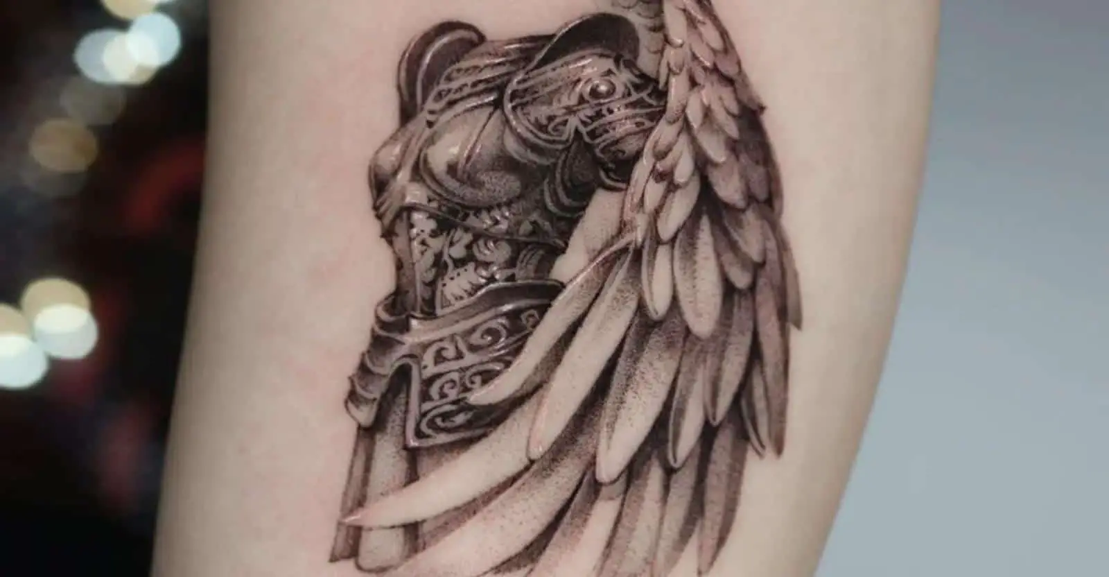 angel wing tattoo in women hand