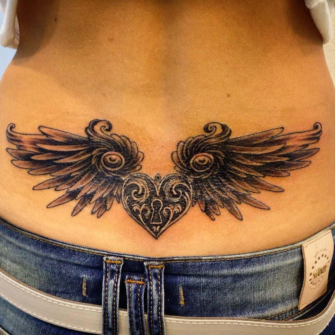 Angel wing lower back tattoos