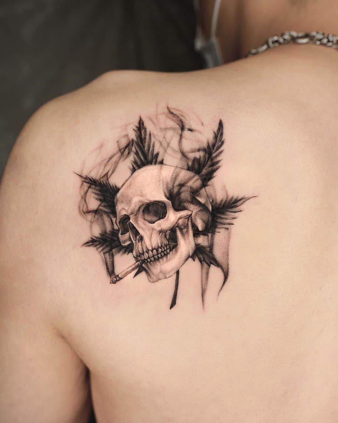 Shoulder skull tattoo