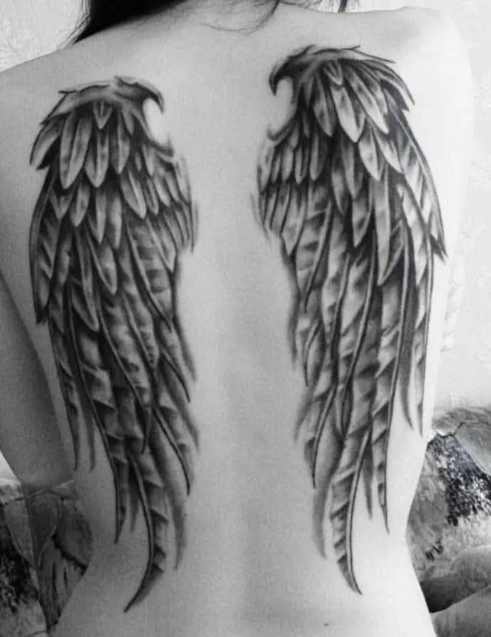 Full-back angel wing tattoo