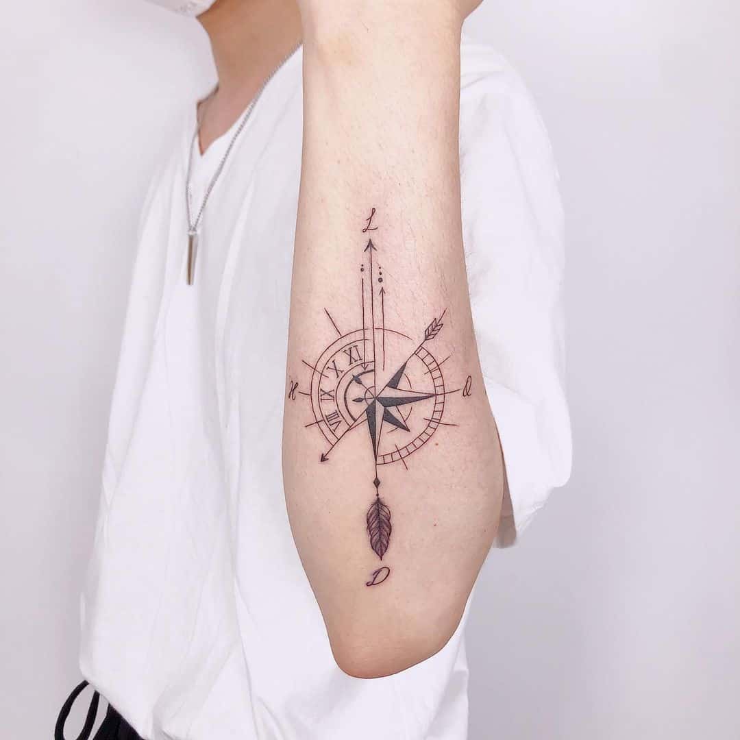 Geometric Compass tattoo on lower arm