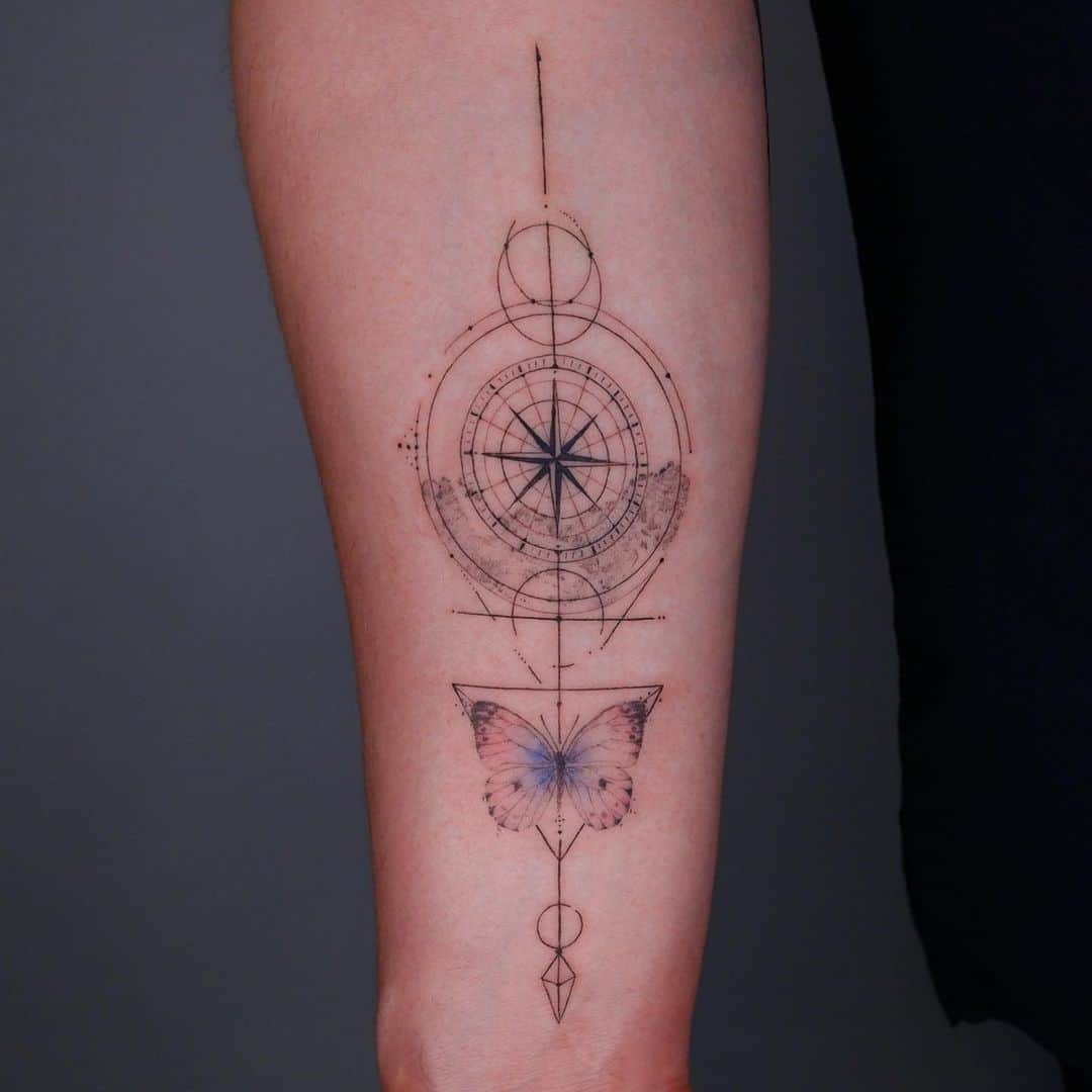 Geometric Compass tattoo with butterfly
