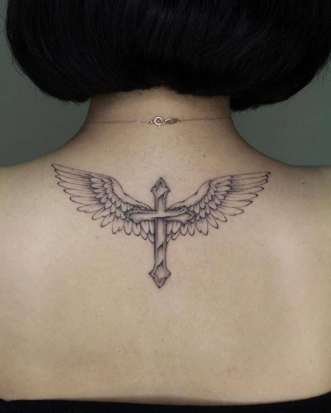 Angel wing tattoo with cross