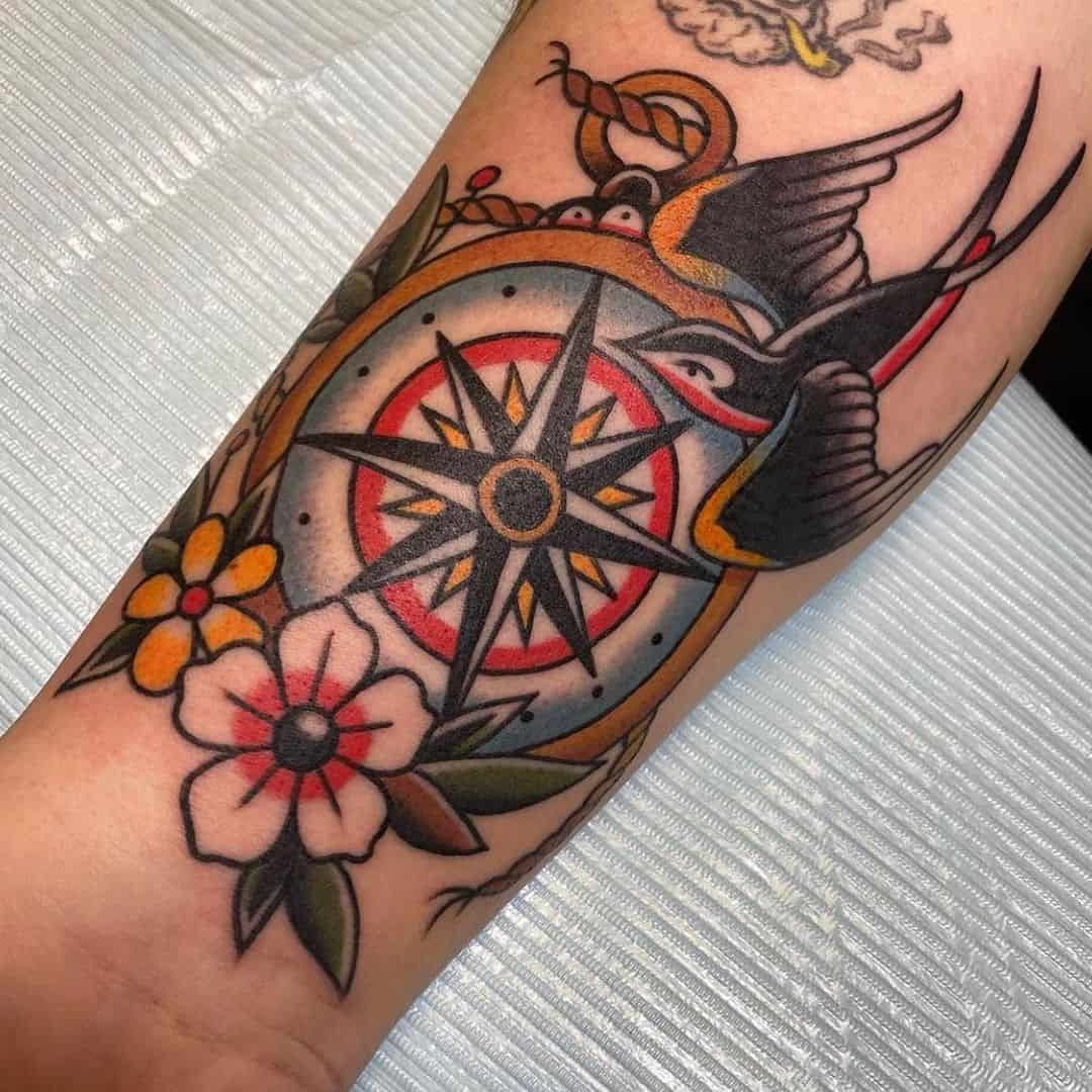 Traditional compass tattoo with bird