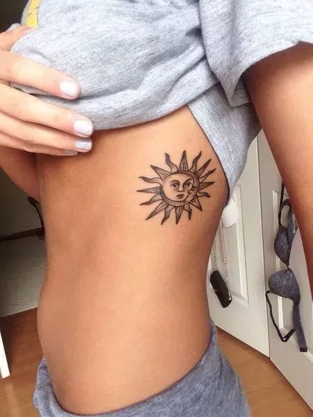 Rib and side simple sun tattoo
