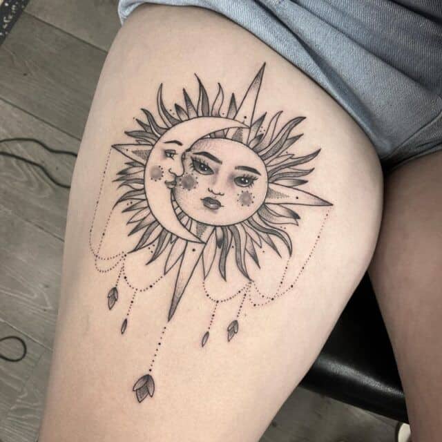 Sun face tattoo design with moon