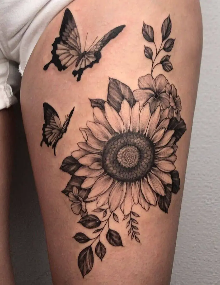 Sunflower and butterfly thigh tattoo