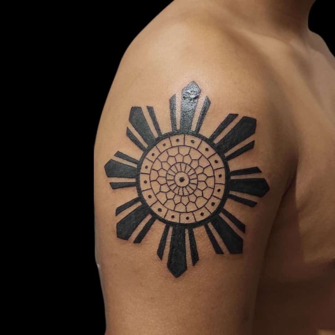 Black work Filipino sun tattoos