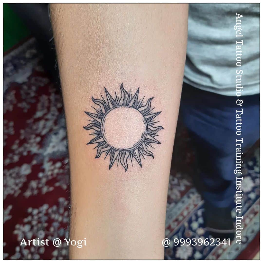 Black and greyTribal sun tattoo design