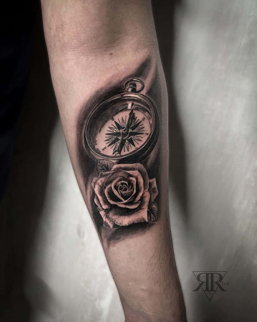 Black and grey compass rose tattoo design 