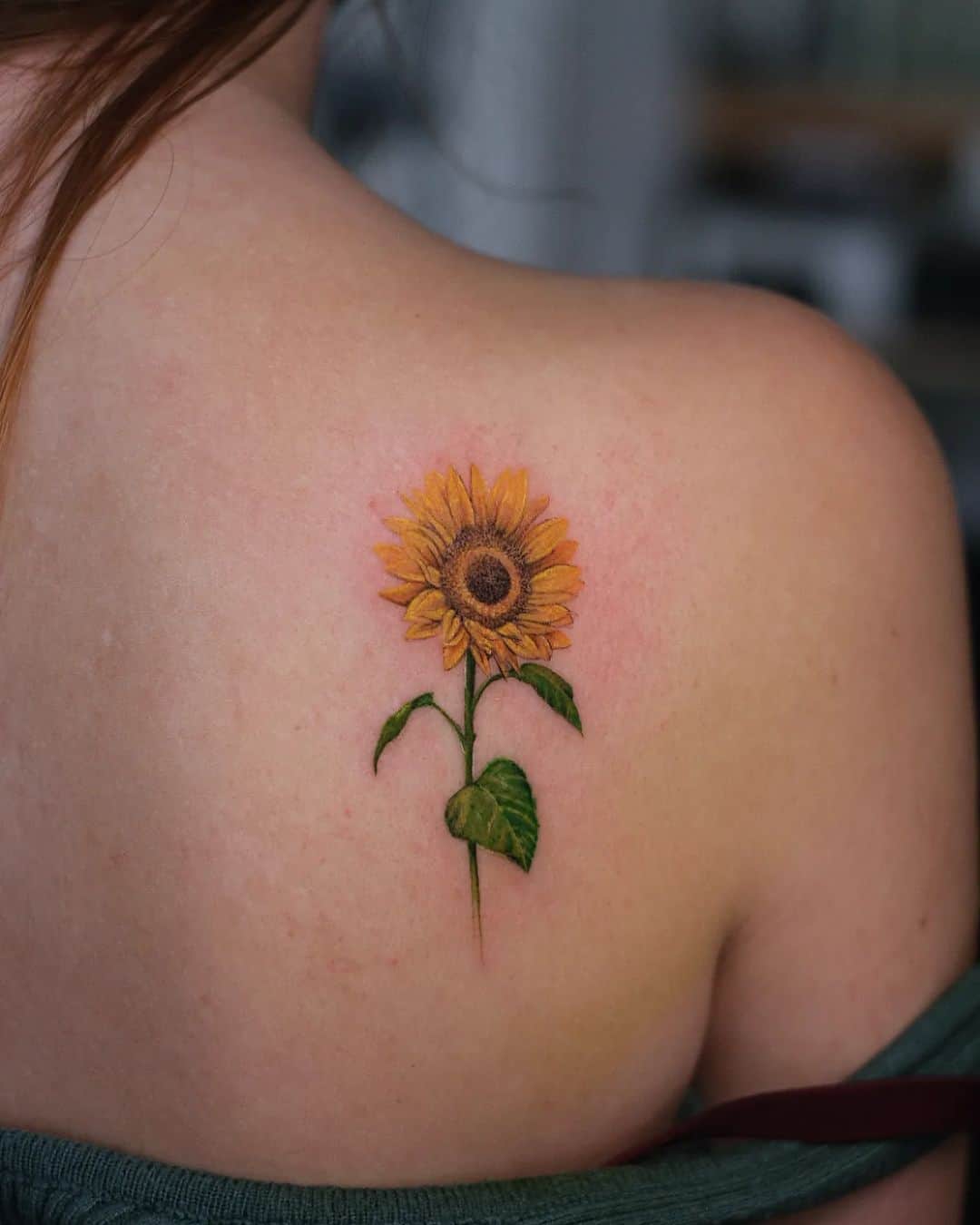 Delicate sunflower tattoos