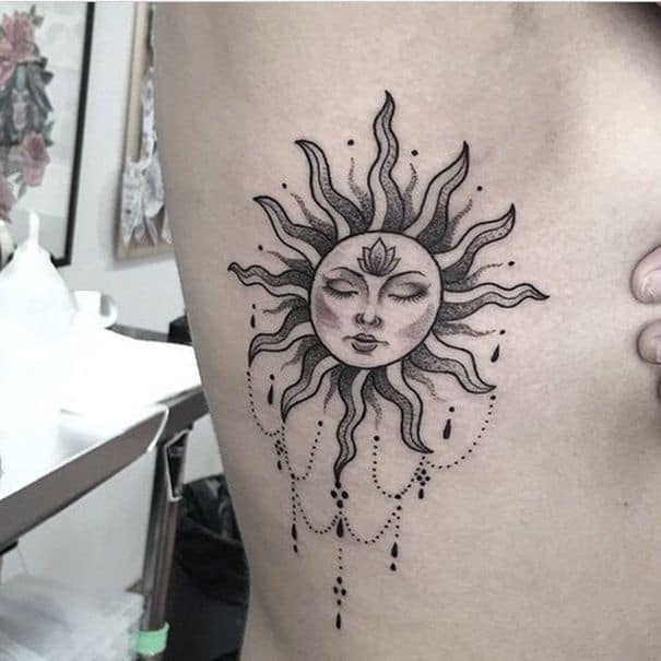 Sun face tattoo design on ribs