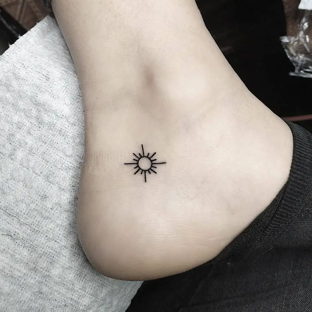 sun tattoo on ankle