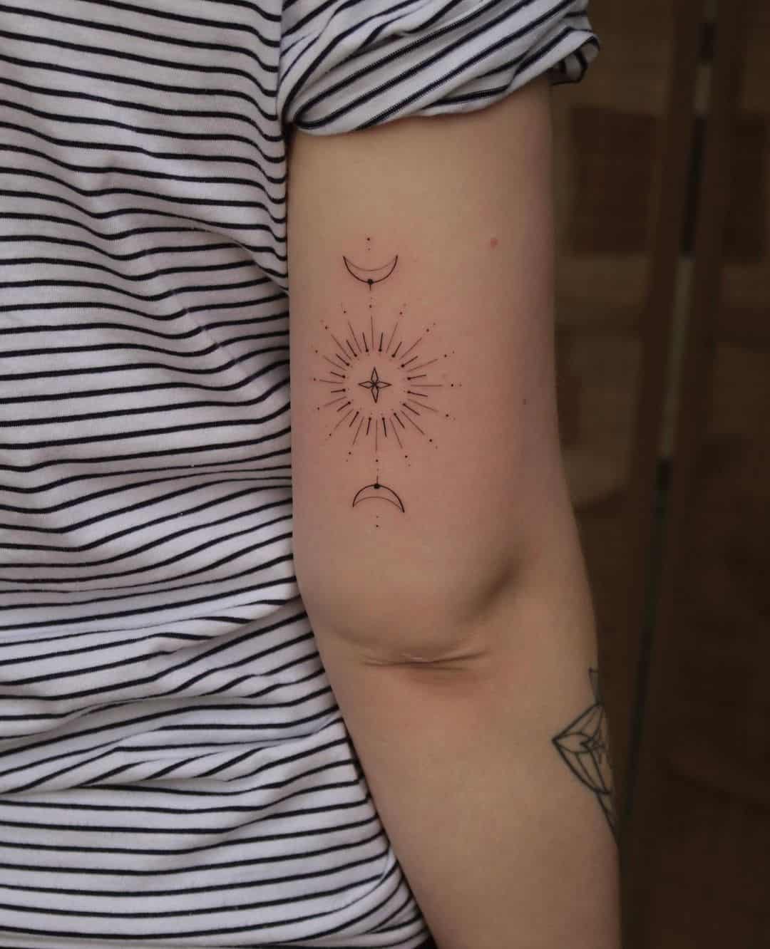 Geometric sun tattoo with half moon