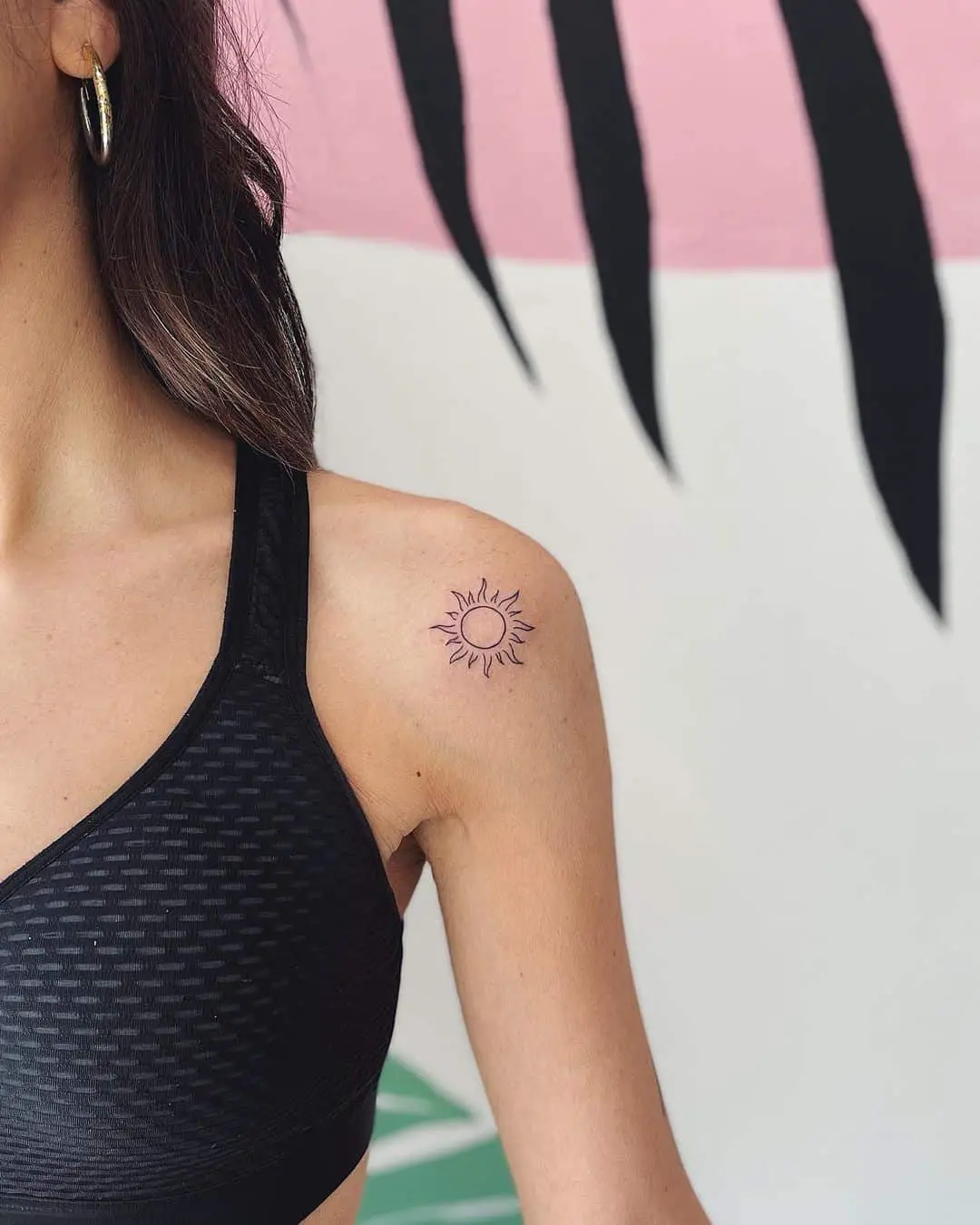 Small Sun Tattoo on shoulder