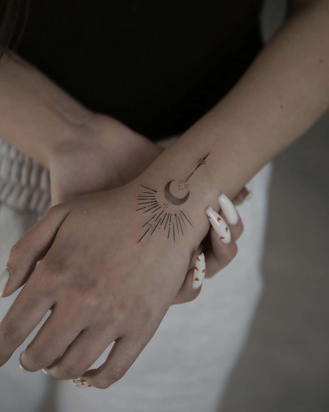 Half sun design tattoo with half moon