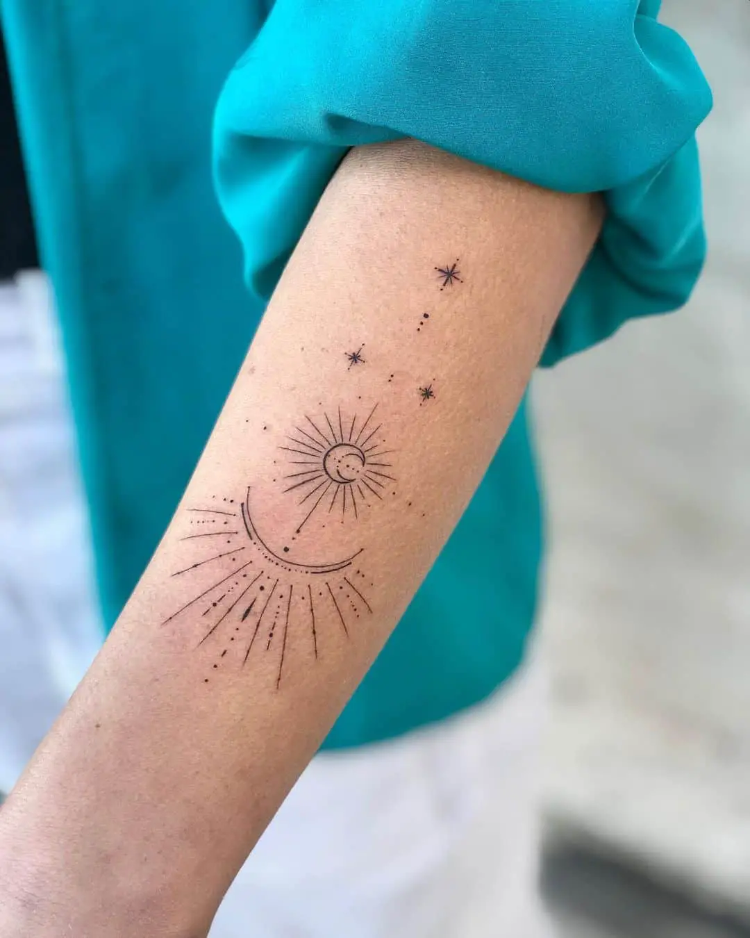 Dotwork Sun Tattoos on lower arm