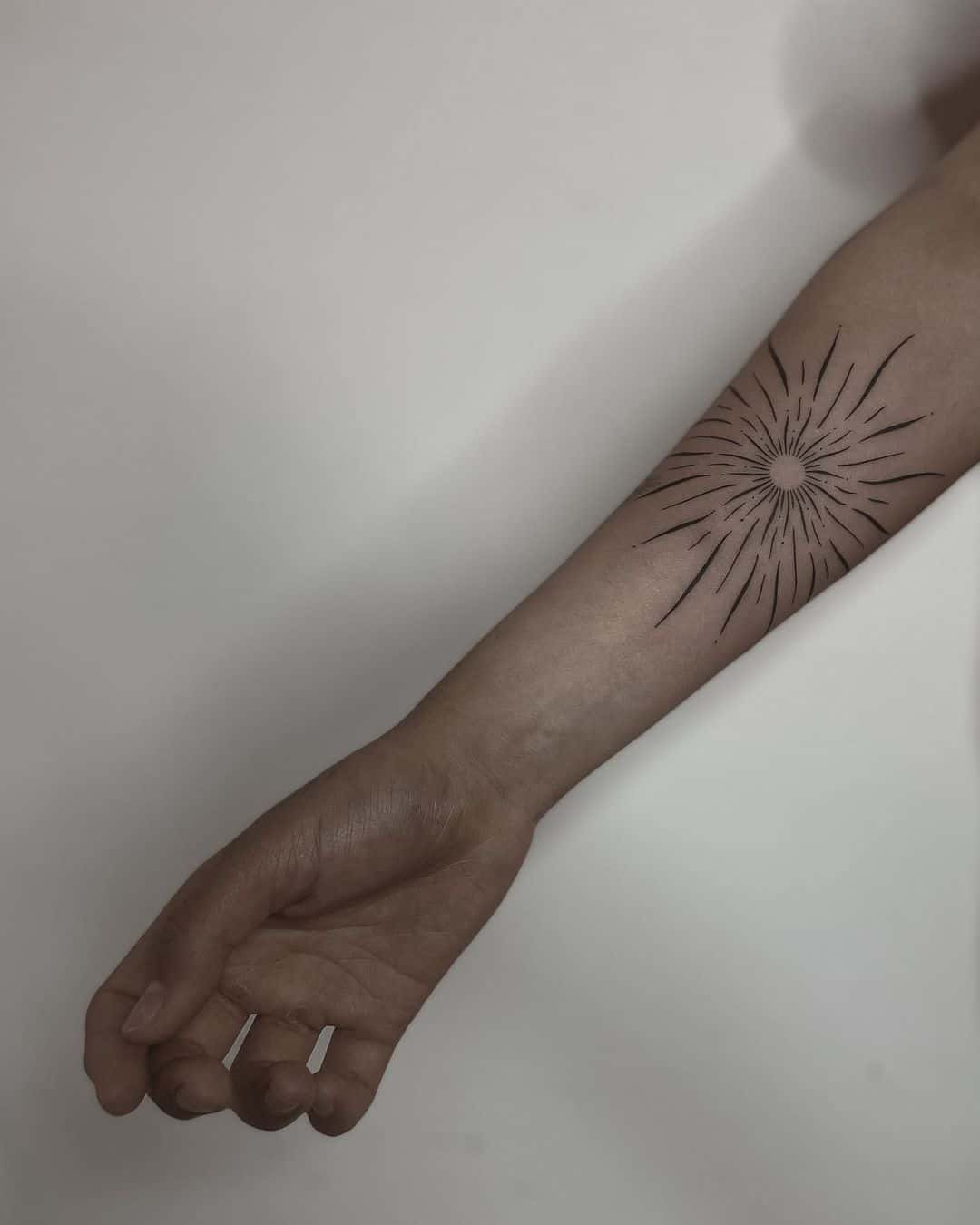 Amazing Sun Rays Tattoo on forearm