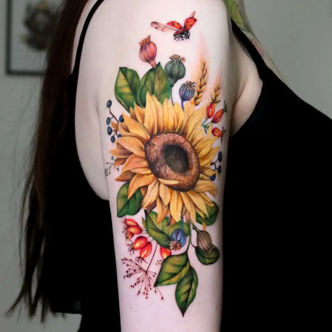 Arm Sunflower Tattoo with ladybird
