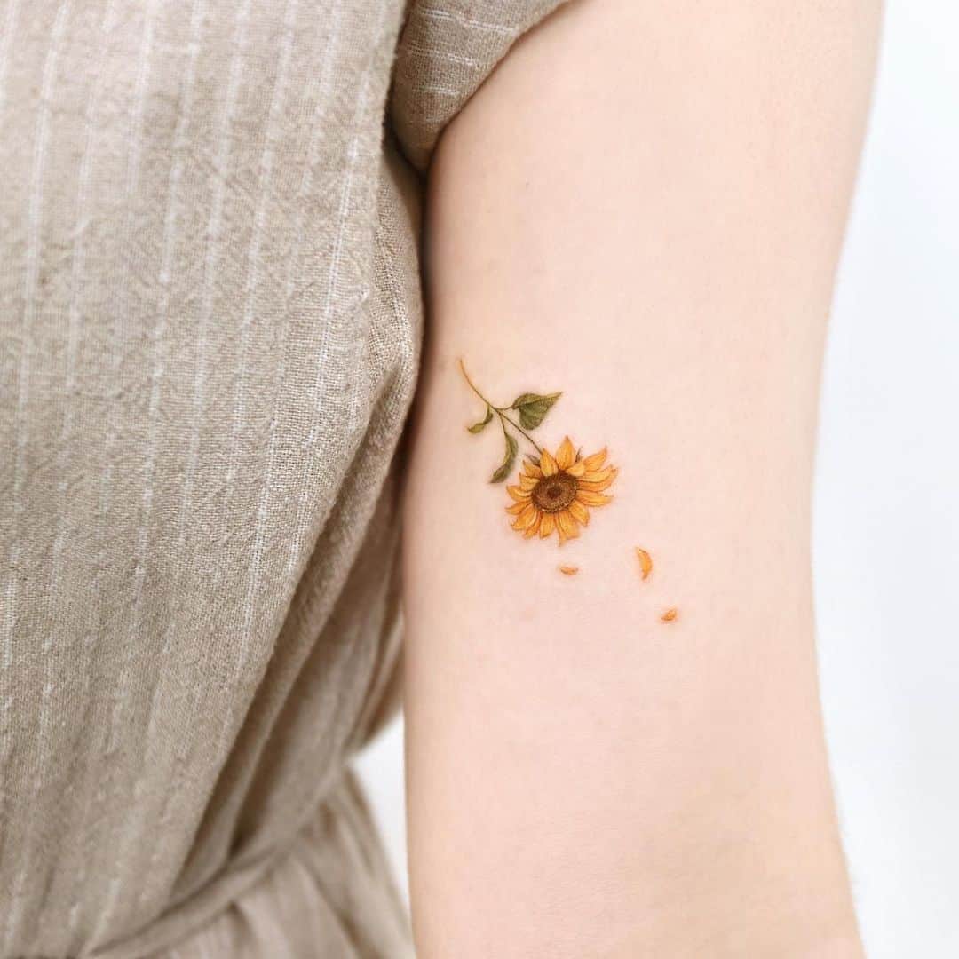 Small Sunflower Tattoo on upper arm