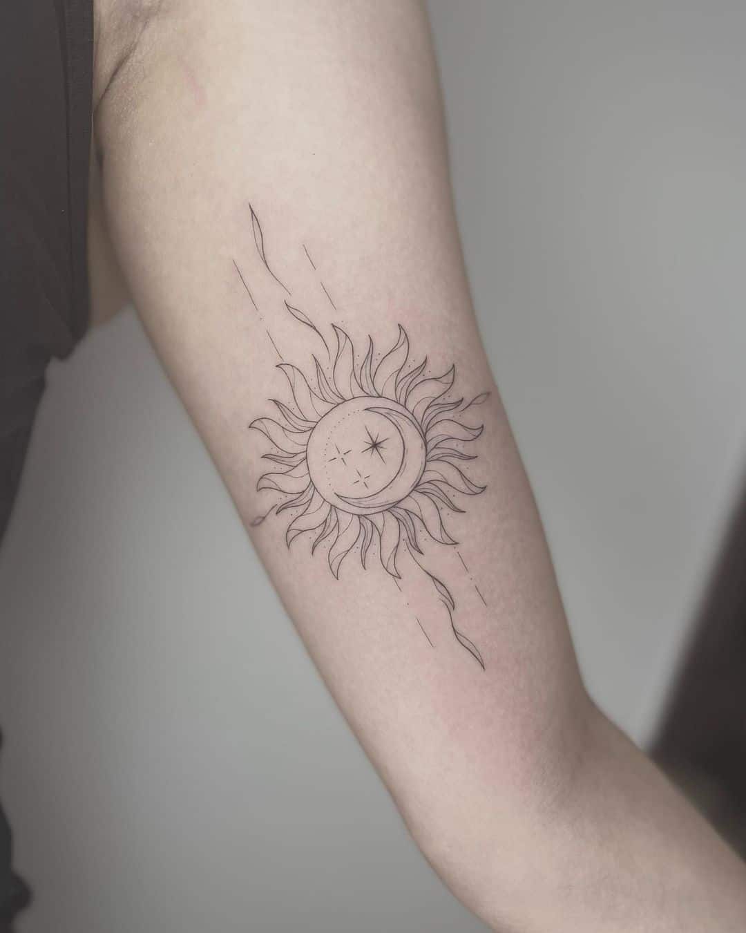 simple sun tattoo design with moon