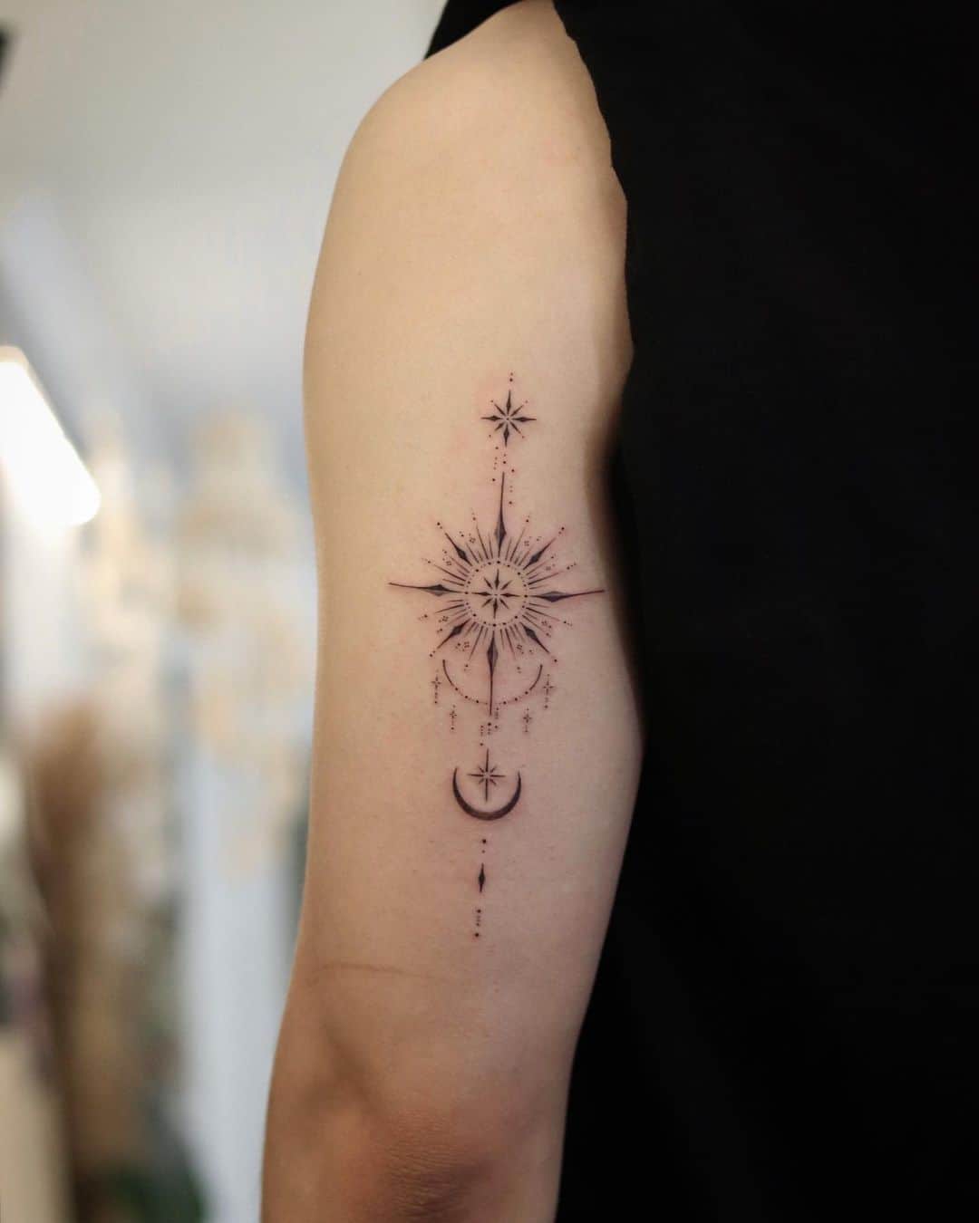 black and greySun and moon tattoo